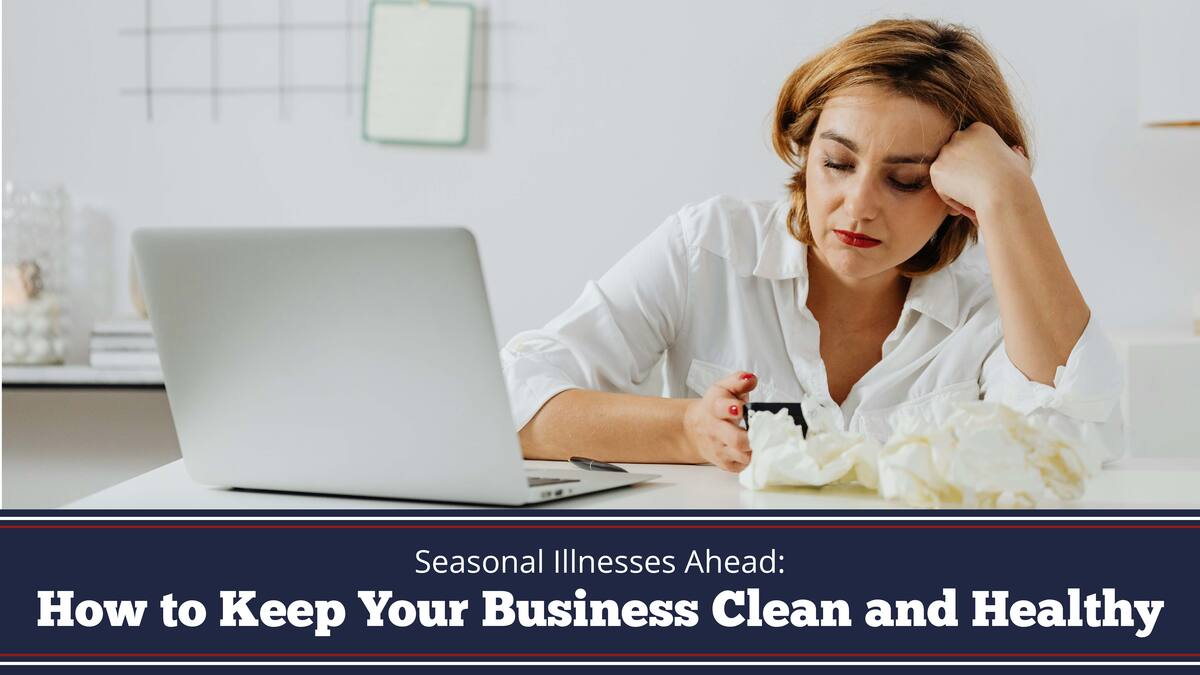 A woman leans on her hand while sitting at a desk with a laptop and a pile of used tissues text reads Seasonal Illnesses Ahead: How to Keep Your Business Clean and Healthy